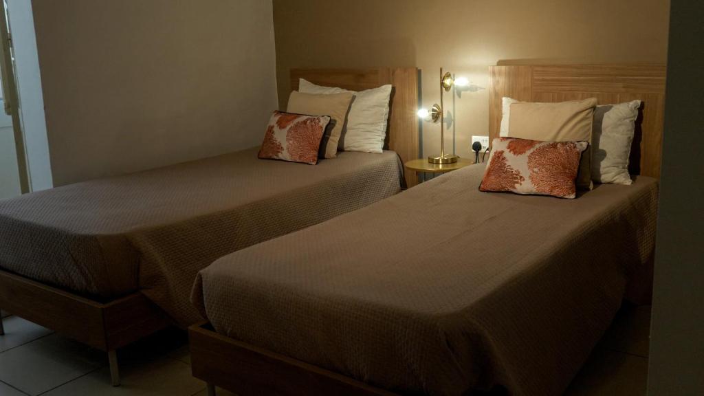Postel nebo postele na pokoji v ubytování Townhouse 26 in Sliema, Malta
