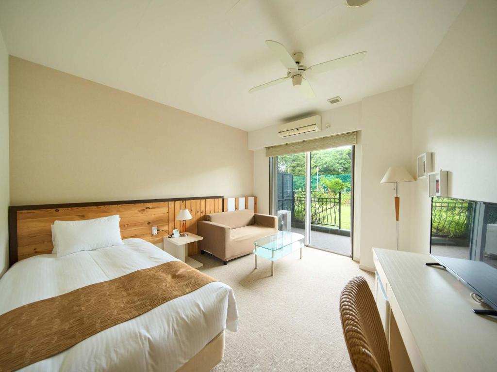 Un pat sau paturi într-o cameră la HOTEL HOLISTIC RESORT - Vacation STAY 34544v