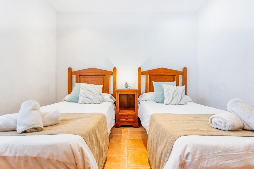 A bed or beds in a room at Can Talaia by dracmallorca