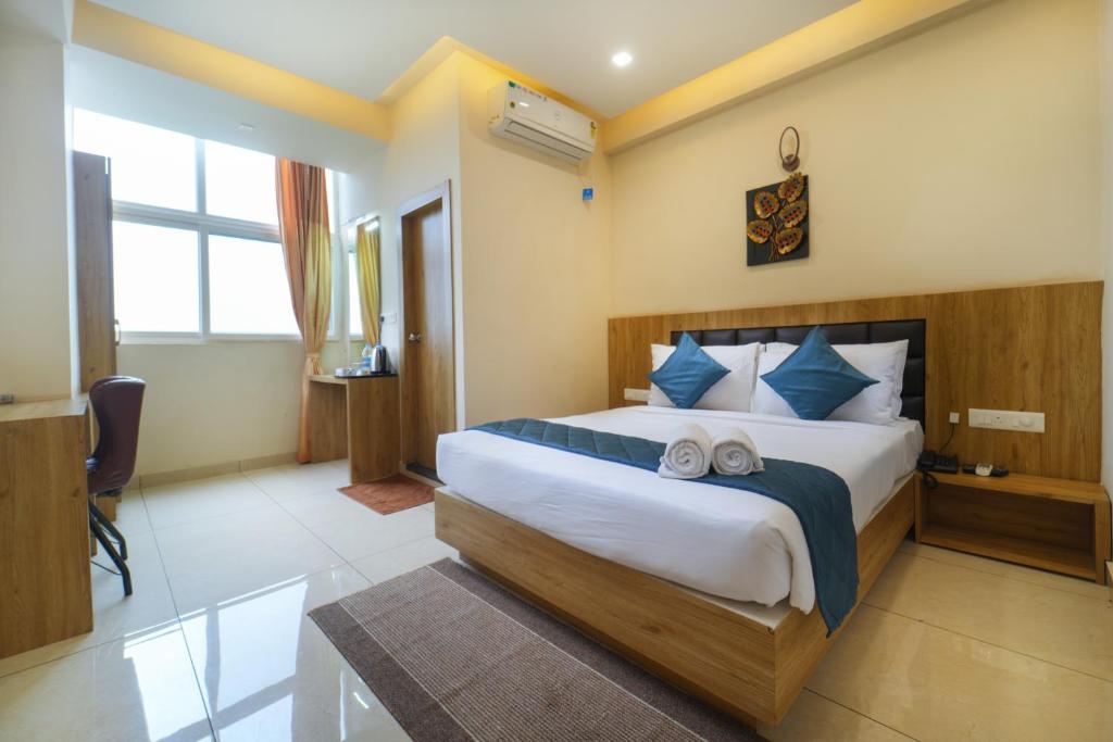 Postel nebo postele na pokoji v ubytování SIGNATURE INN
