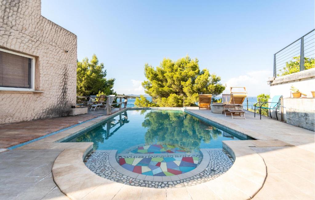 a swimming pool in the middle of a house at 5 Bedroom Stunning Home In Zman in Žman