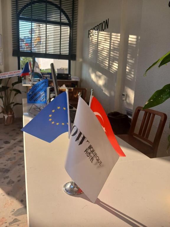 an office desk with flags on top of it at Now Boutique Hotel in Erdemli