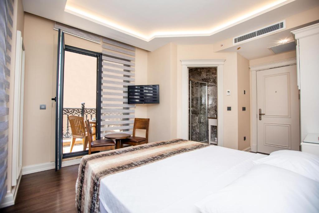 Postel nebo postele na pokoji v ubytování Opatija Hotel