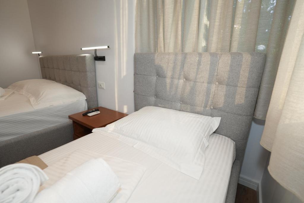 Postel nebo postele na pokoji v ubytování Muko's Apartments