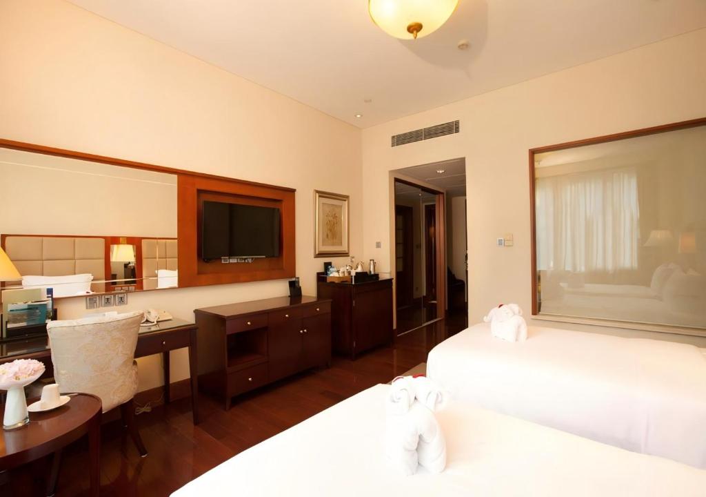 Postel nebo postele na pokoji v ubytování Seaview Resort Xiamen