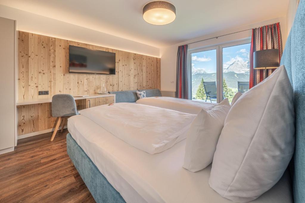 Postel nebo postele na pokoji v ubytování Hotel Winterer