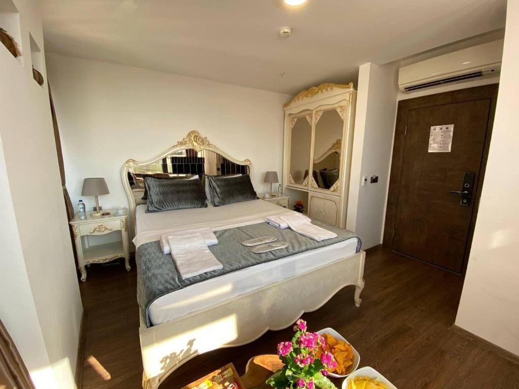 Postel nebo postele na pokoji v ubytování Pandora Hotel