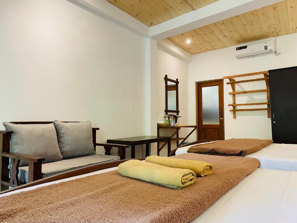 Postel nebo postele na pokoji v ubytování Wild Resort Ella