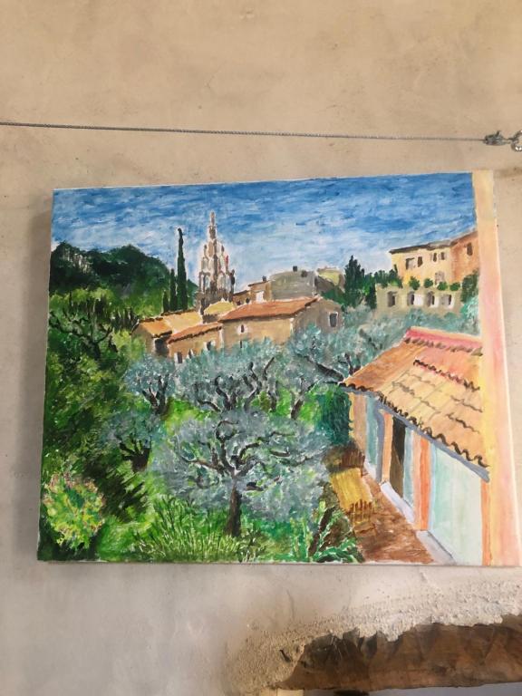 une peinture d'une ville avec des arbres et des bâtiments dans l'établissement appartement centre ville pleine nature, à Nyons