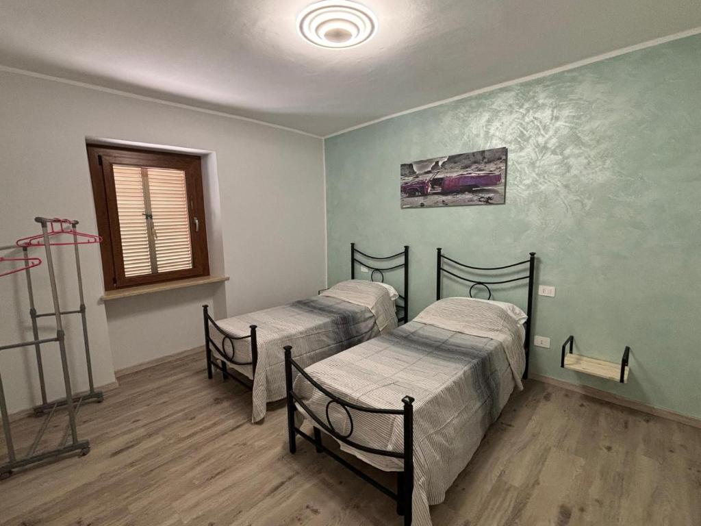 Postel nebo postele na pokoji v ubytování Agriturismo B&B La Cerasa