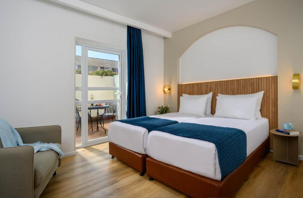 Postel nebo postele na pokoji v ubytování Prima Palace Hotel