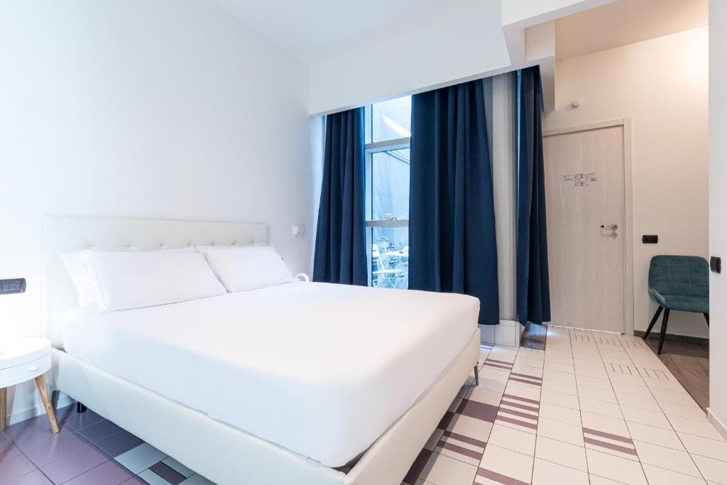 Postel nebo postele na pokoji v ubytování Città Studi Suites - Top Collection