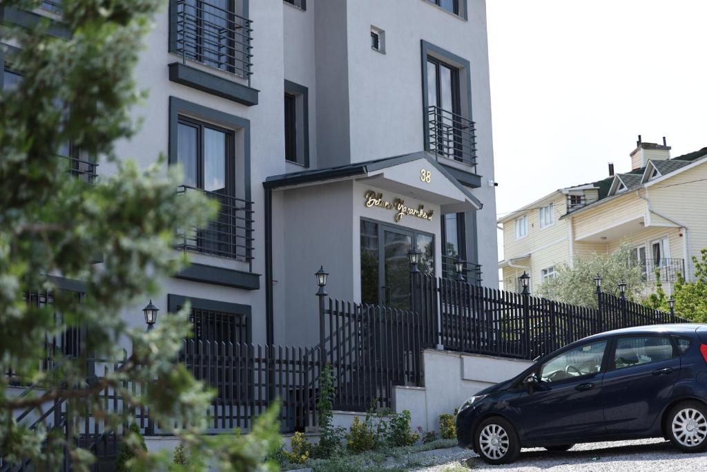 a black car parked in front of a building at Deluna Yaşamkent in Çankaya