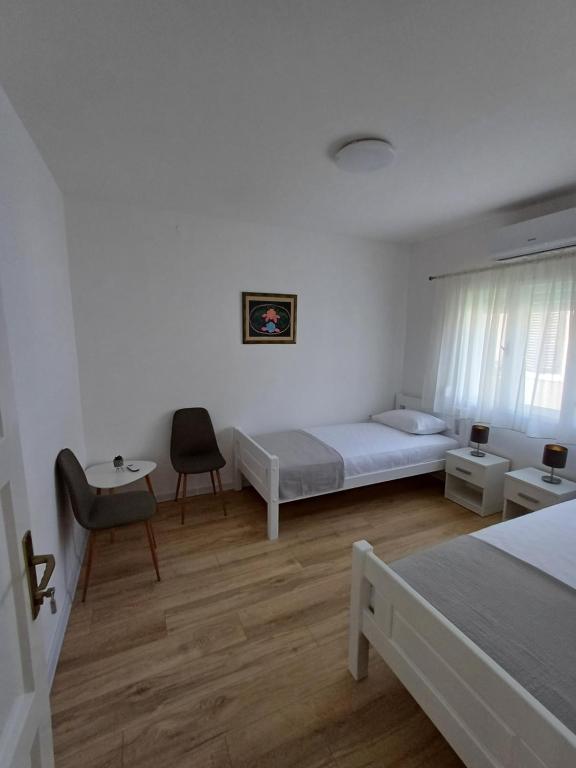 Postel nebo postele na pokoji v ubytování Guest House Mostar