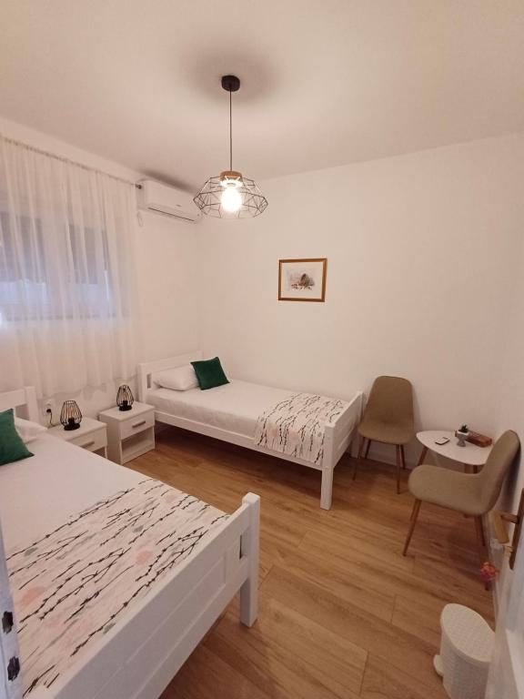 Postel nebo postele na pokoji v ubytování Guest House Mostar