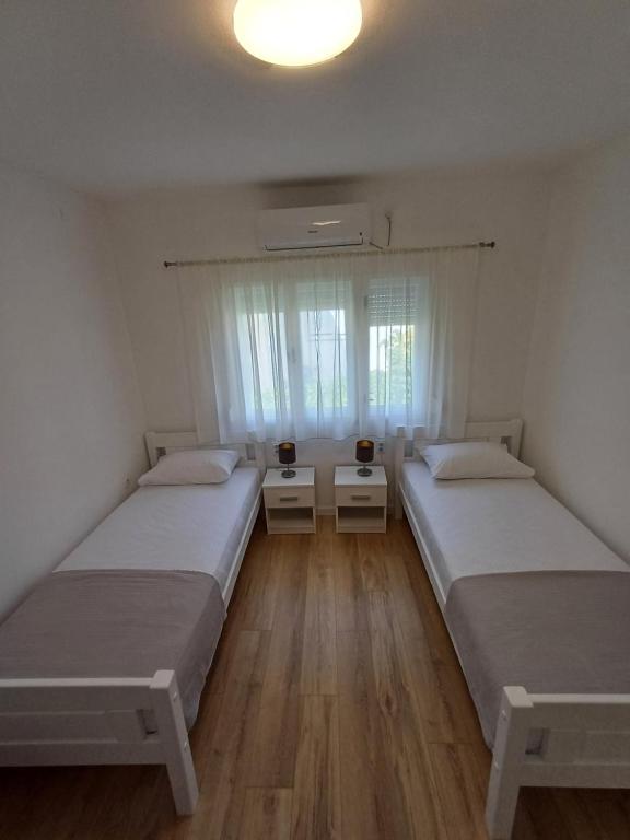 Postel nebo postele na pokoji v ubytování Guest House Mostar