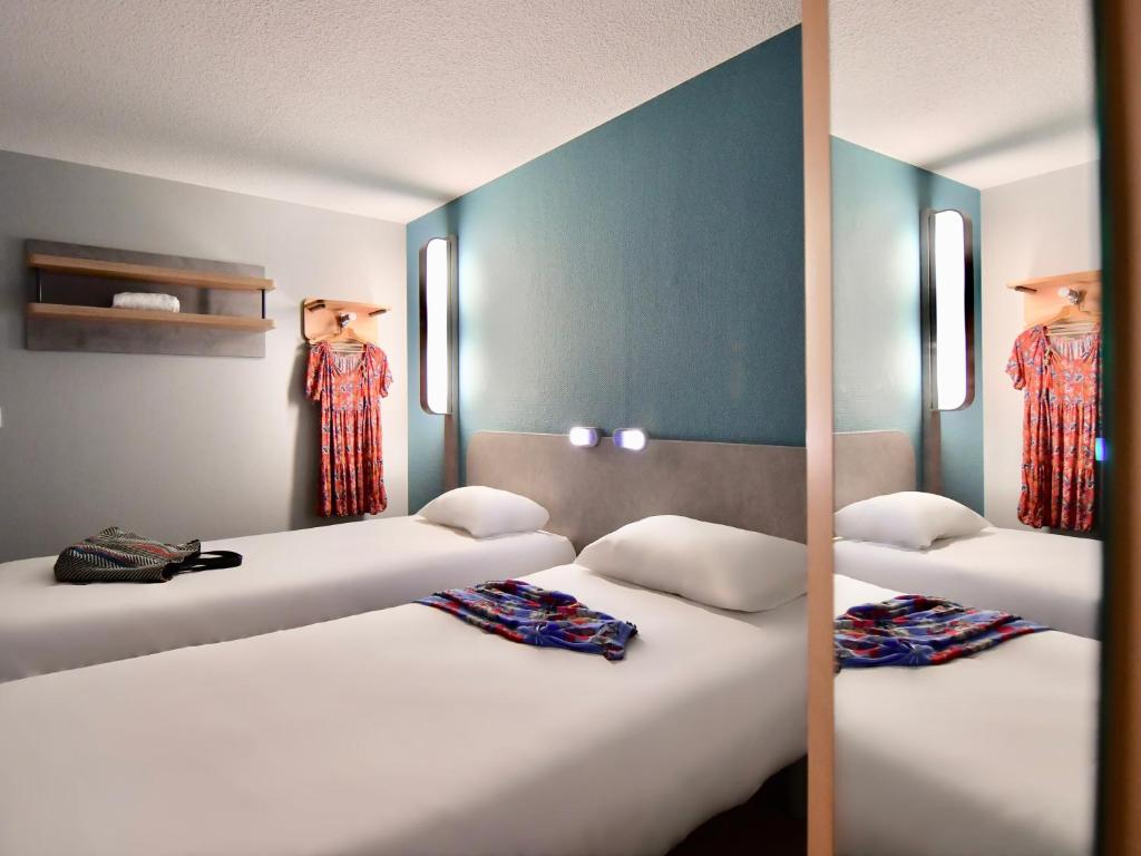 Postel nebo postele na pokoji v ubytování ibis budget Vannes