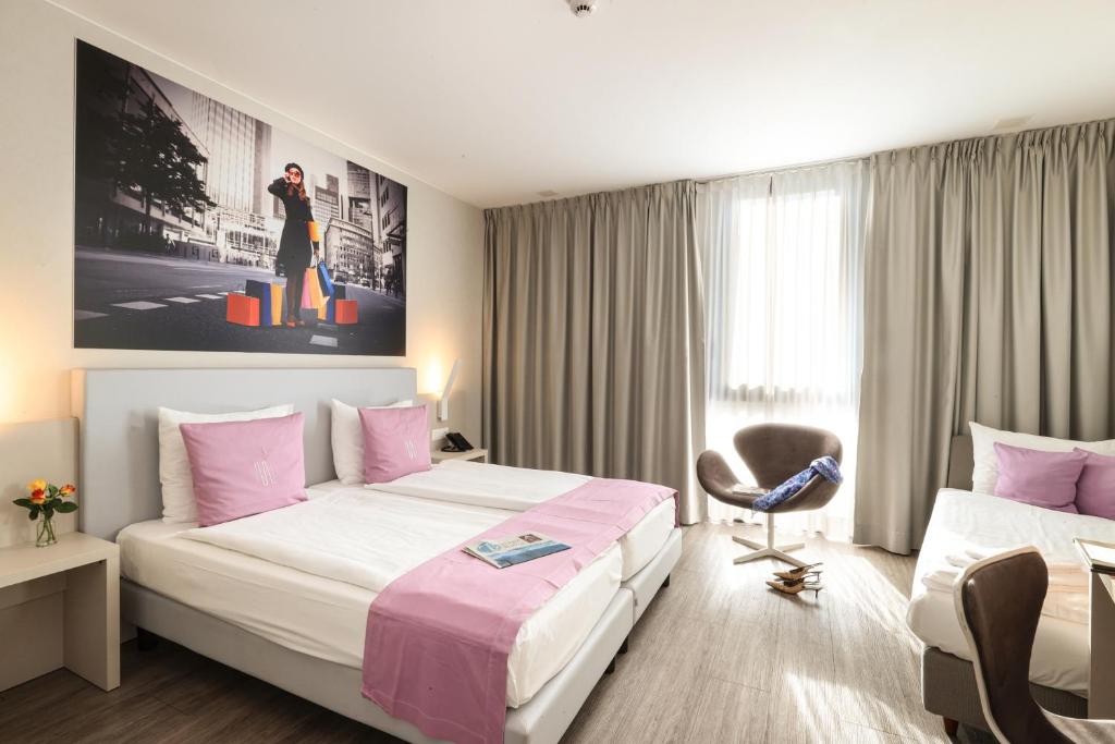 Postel nebo postele na pokoji v ubytování Hotel City Lugano