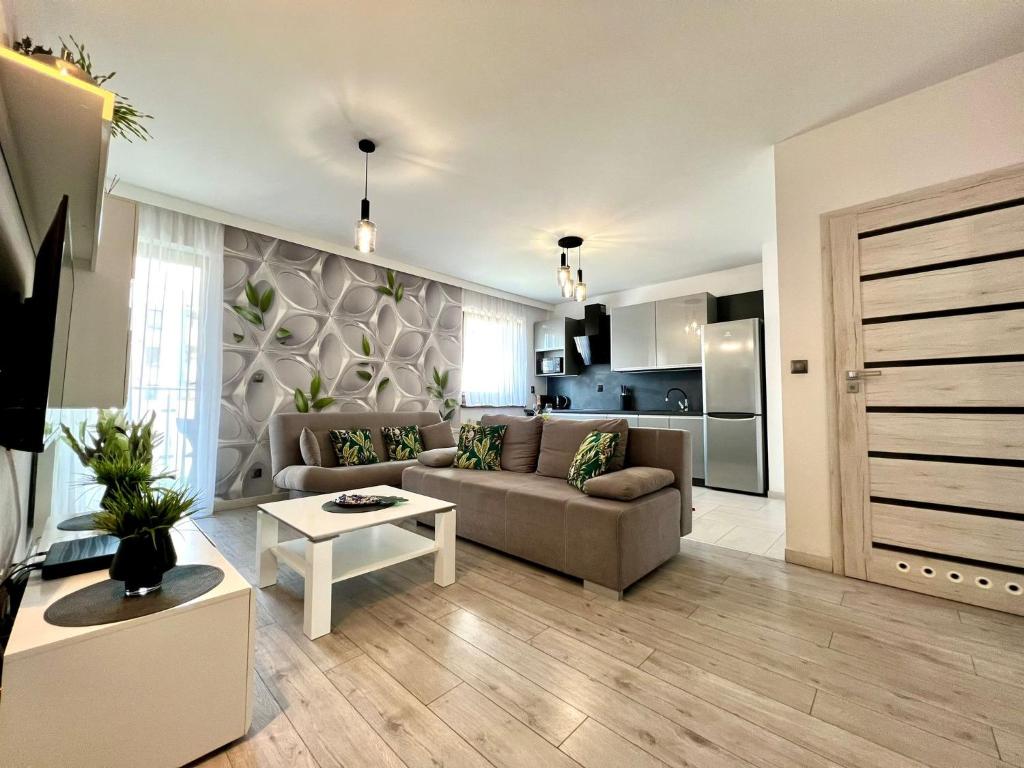 a living room with a couch and a table at Apartament Eva 2 in Jelenia Góra