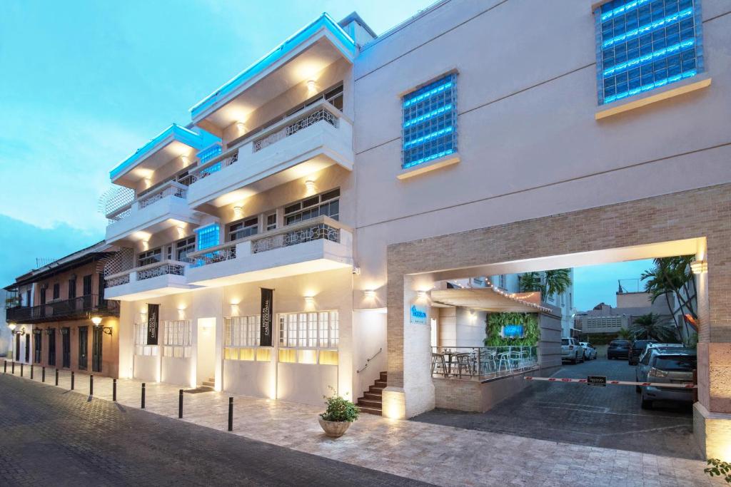 a large white building with lights on at Hodelpa Caribe Colonial in Santo Domingo