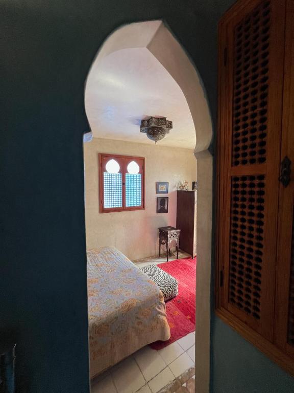 Postel nebo postele na pokoji v ubytování La suite de L'air de Tanger