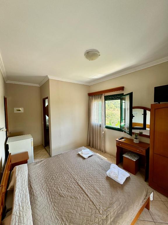 Postel nebo postele na pokoji v ubytování Hotel Filoxenia