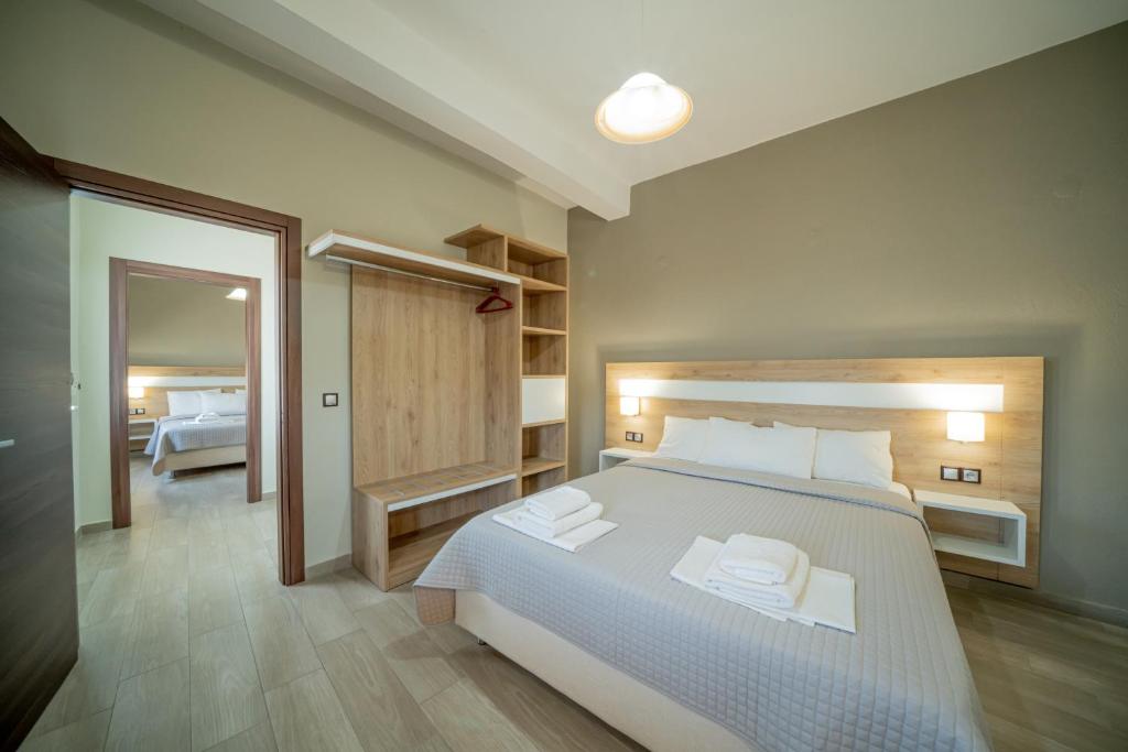 Postel nebo postele na pokoji v ubytování Hotel Olympion