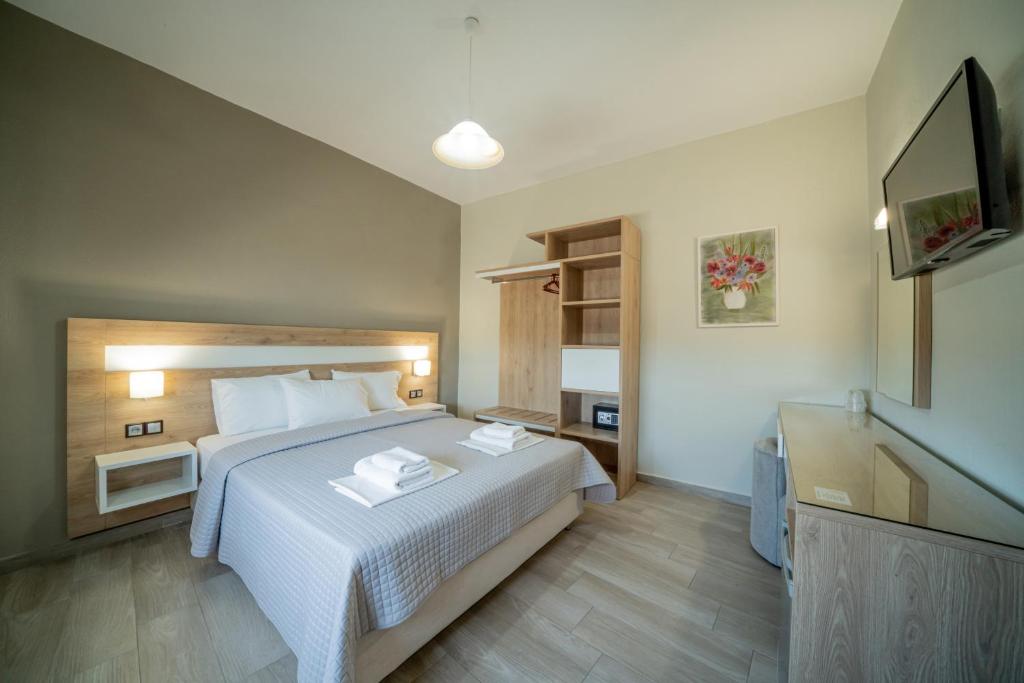 Postel nebo postele na pokoji v ubytování Hotel Olympion