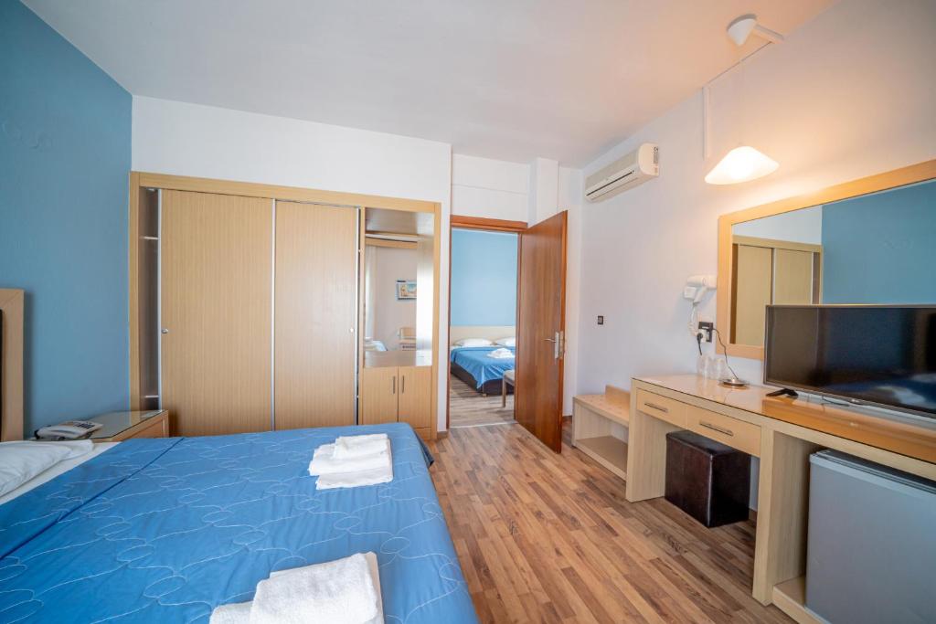 Postel nebo postele na pokoji v ubytování Hotel Olympion