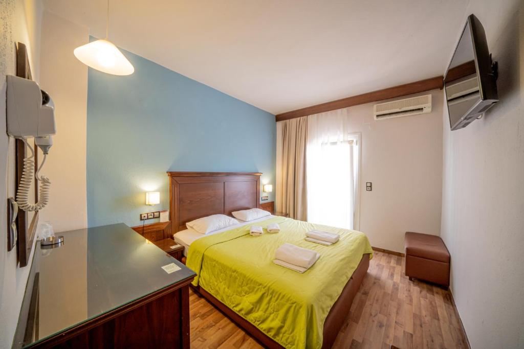 Postel nebo postele na pokoji v ubytování Hotel Olympion