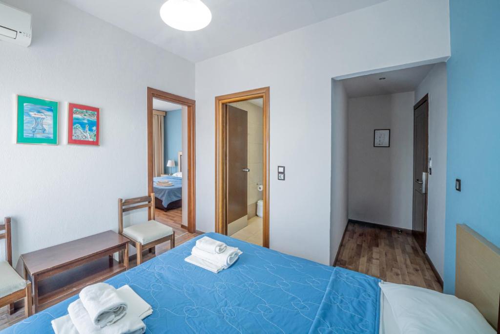 Postel nebo postele na pokoji v ubytování Hotel Olympion
