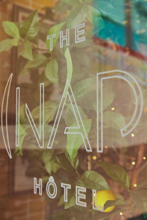 a glass window with a sign that reads the hotel at Hotel Nap By HappyCulture in Nice