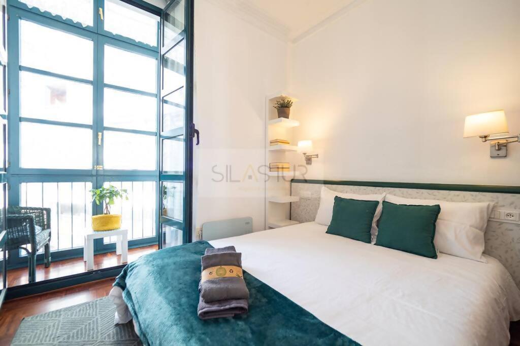 Ένα ή περισσότερα κρεβάτια σε δωμάτιο στο Pelayo 2 Apartamento