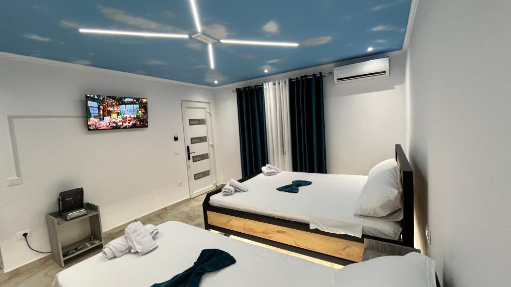 Postel nebo postele na pokoji v ubytování Hotel Davids
