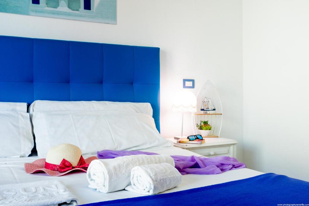Postel nebo postele na pokoji v ubytování Riva Eco Guest House