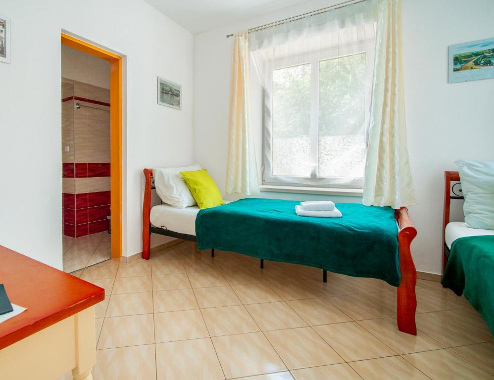 Postel nebo postele na pokoji v ubytování Hotel Ostende