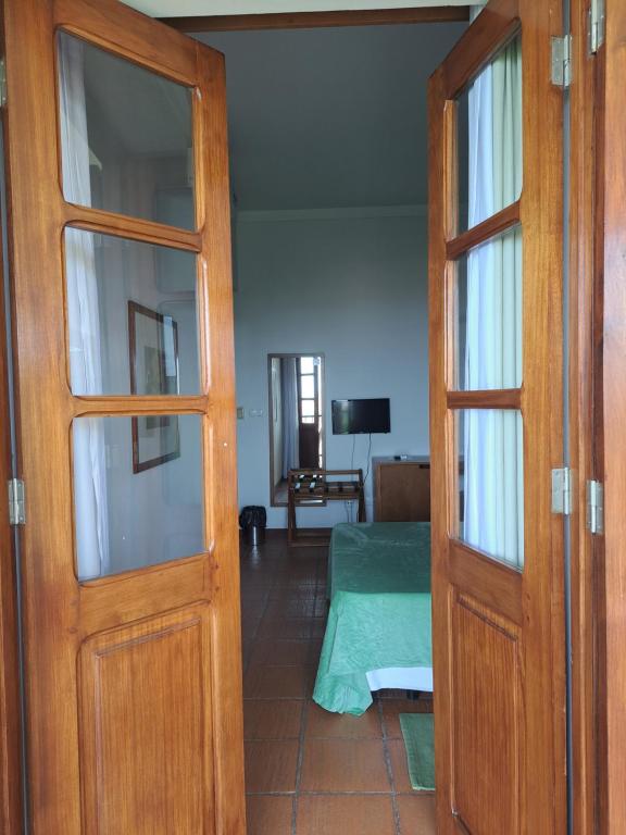 Postel nebo postele na pokoji v ubytování Bamboo Xaguate Hotel