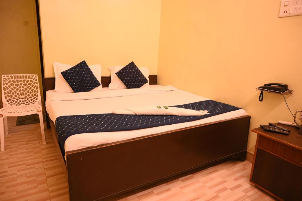 Postel nebo postele na pokoji v ubytování Rameshwaram Guest House