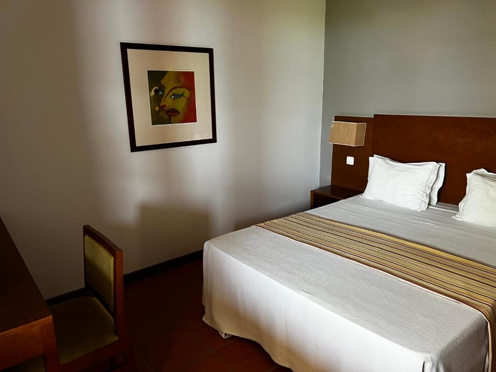 Postel nebo postele na pokoji v ubytování Bamboo Xaguate Hotel