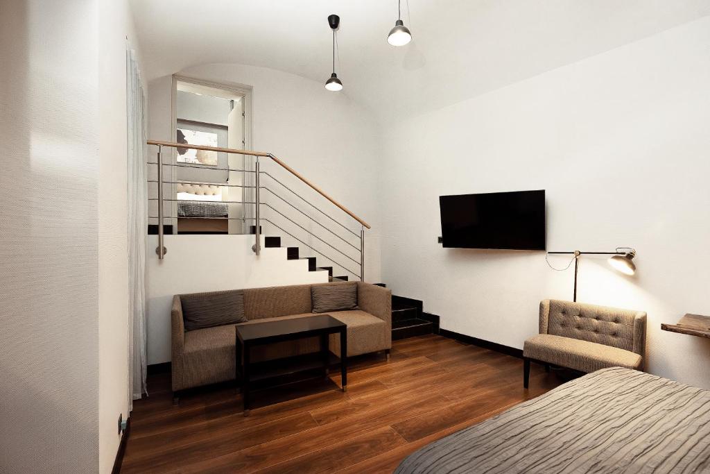 TV a/nebo společenská místnost v ubytování Quentin Prague Hotel