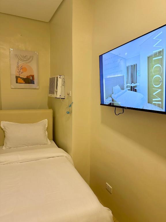 Postel nebo postele na pokoji v ubytování THE VELVET SUITES AND HOTEL