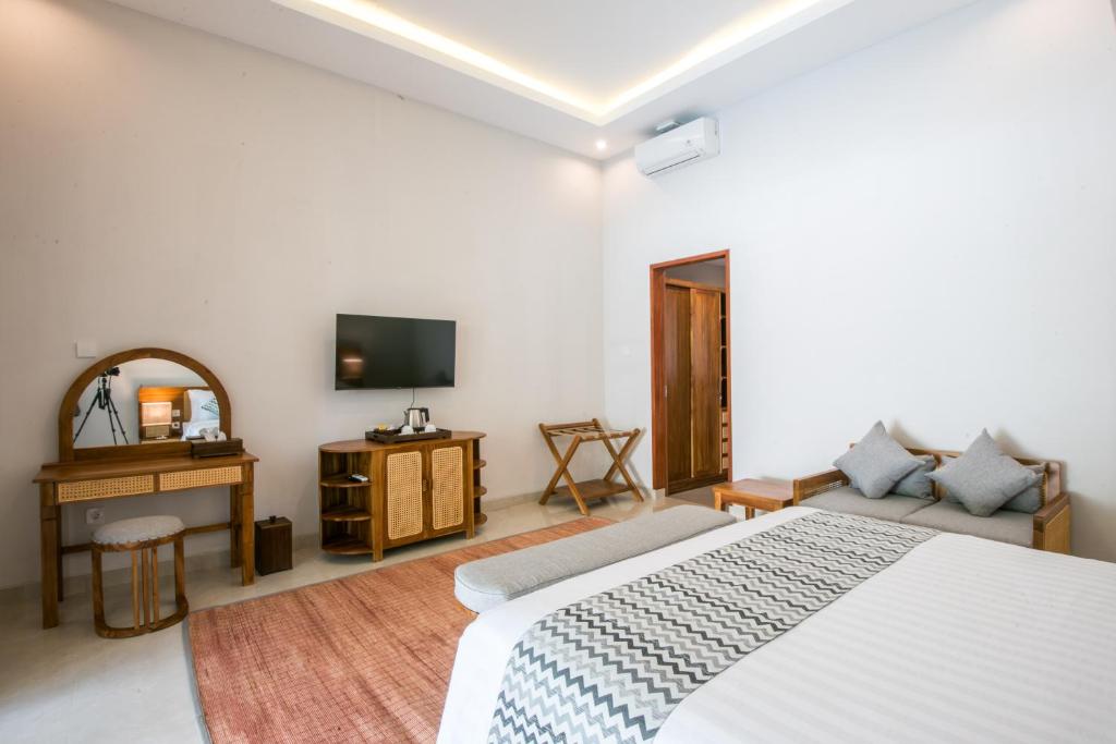 Postel nebo postele na pokoji v ubytování Bhumi Sangtu Ubud