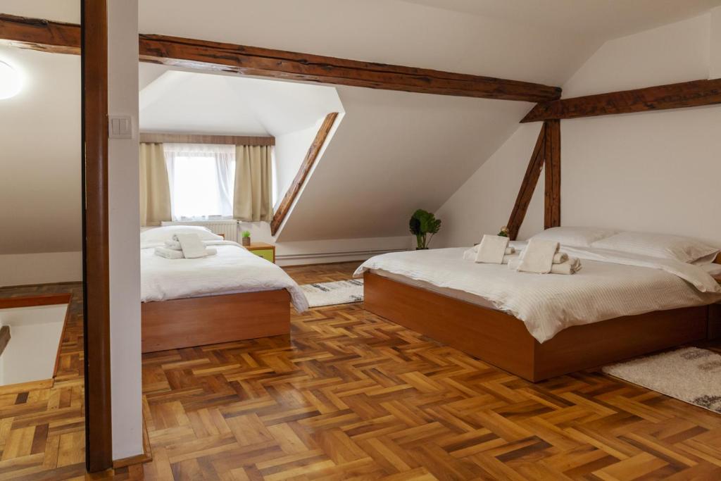Postel nebo postele na pokoji v ubytování Prenoćište Omega Luxury