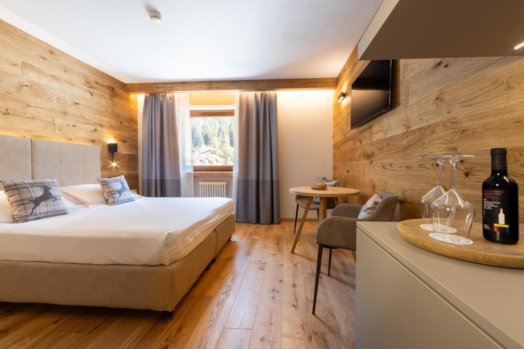 Łóżko lub łóżka w pokoju w obiekcie Hotel Relais Des Glaciers - Adults Only