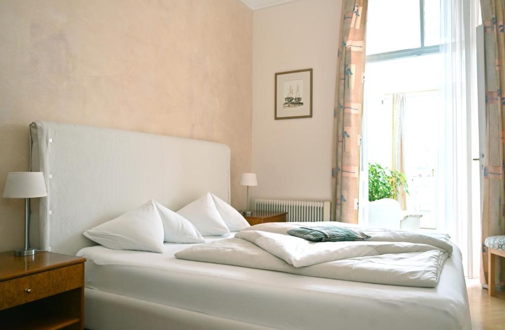 Postel nebo postele na pokoji v ubytování Seehotel Astoria