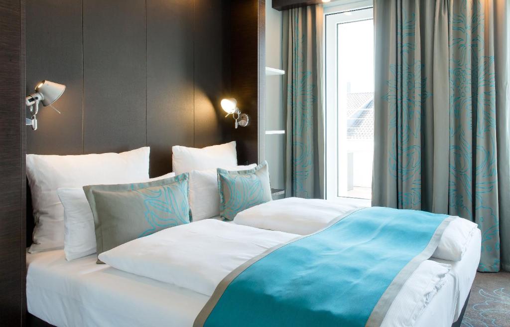 Letto o letti in una camera di Motel One Stuttgart-Bad Cannstatt