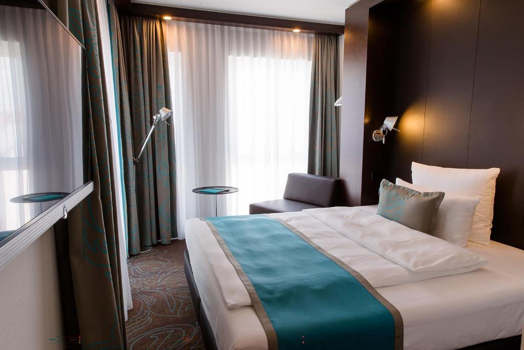 Letto o letti in una camera di Motel One Stuttgart-Bad Cannstatt