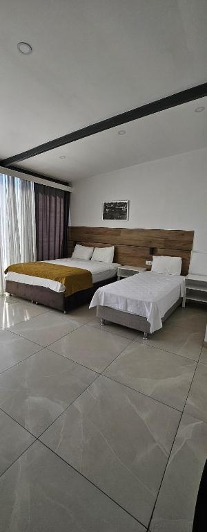 Postel nebo postele na pokoji v ubytování Tut Hotel
