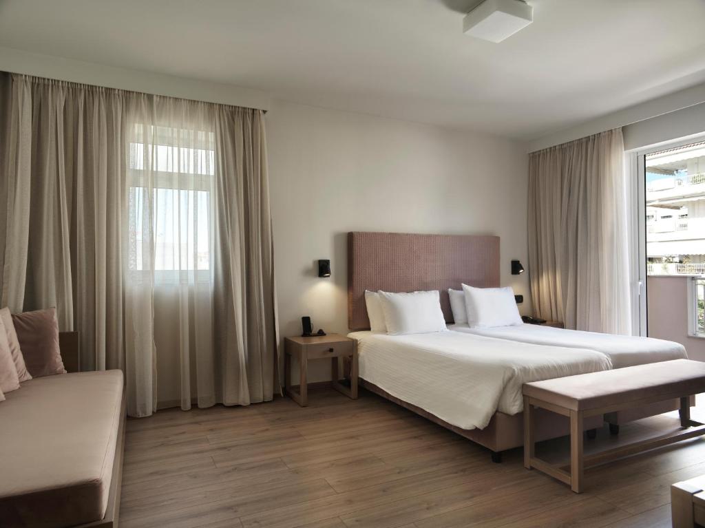 Postel nebo postele na pokoji v ubytování Civitel Attik Rooms & Suites