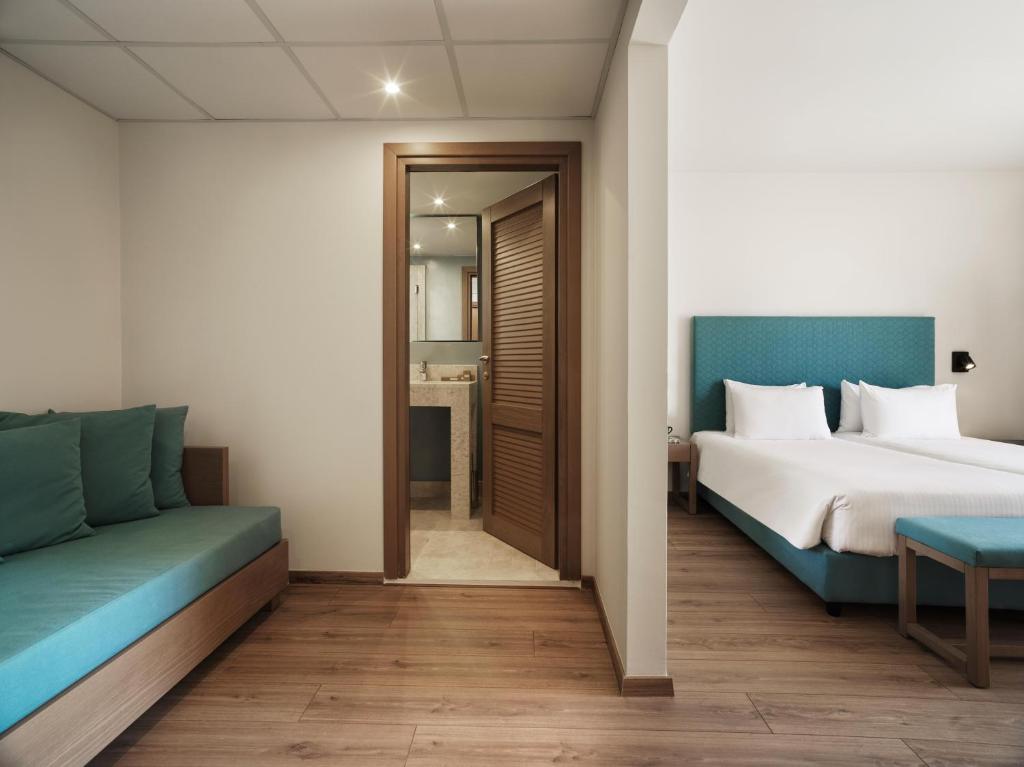 Postel nebo postele na pokoji v ubytování Civitel Attik Rooms & Suites